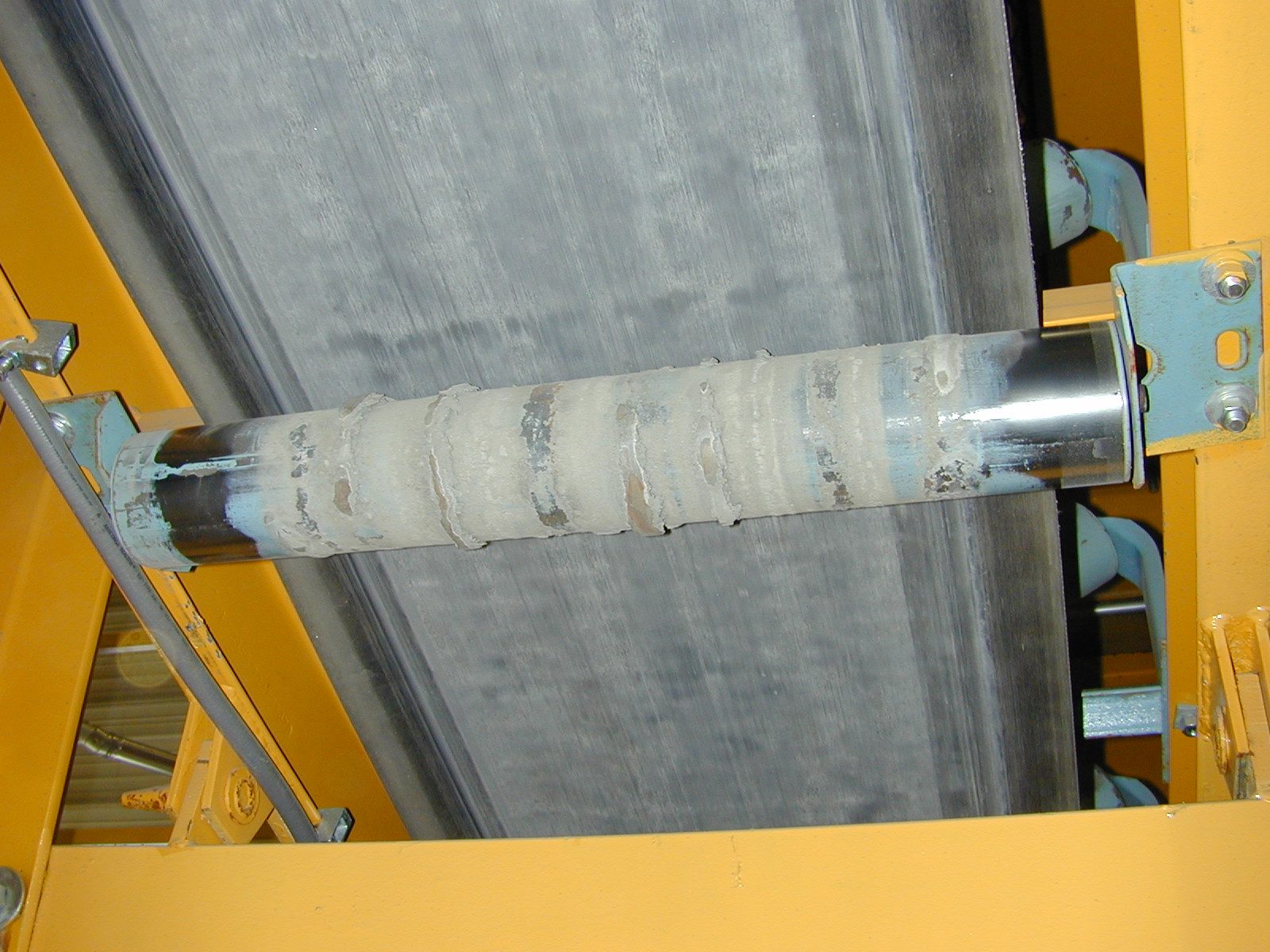 Painted steel showing corrosion breakthrough at welds and edges