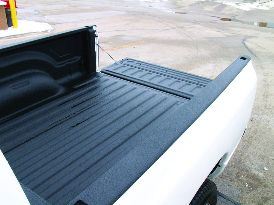 Truck bed with sprayed polyurea instead of bed paint